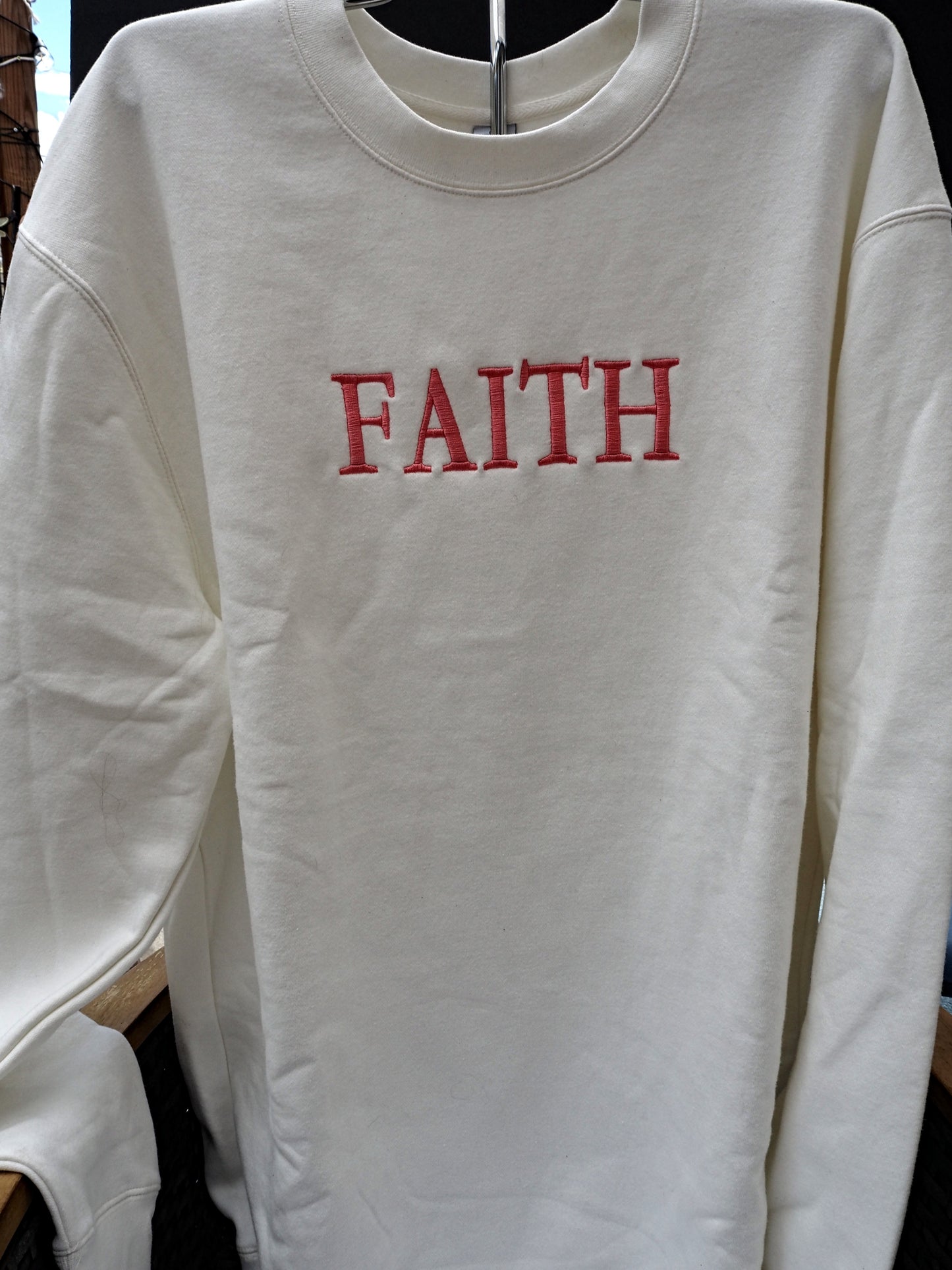 FAITH embroidered crewneck sweatshirt in cream white with red lettering