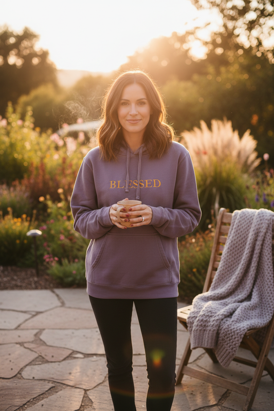 Lifestyle photo of woman wearing BLESSED hoodie outdoors